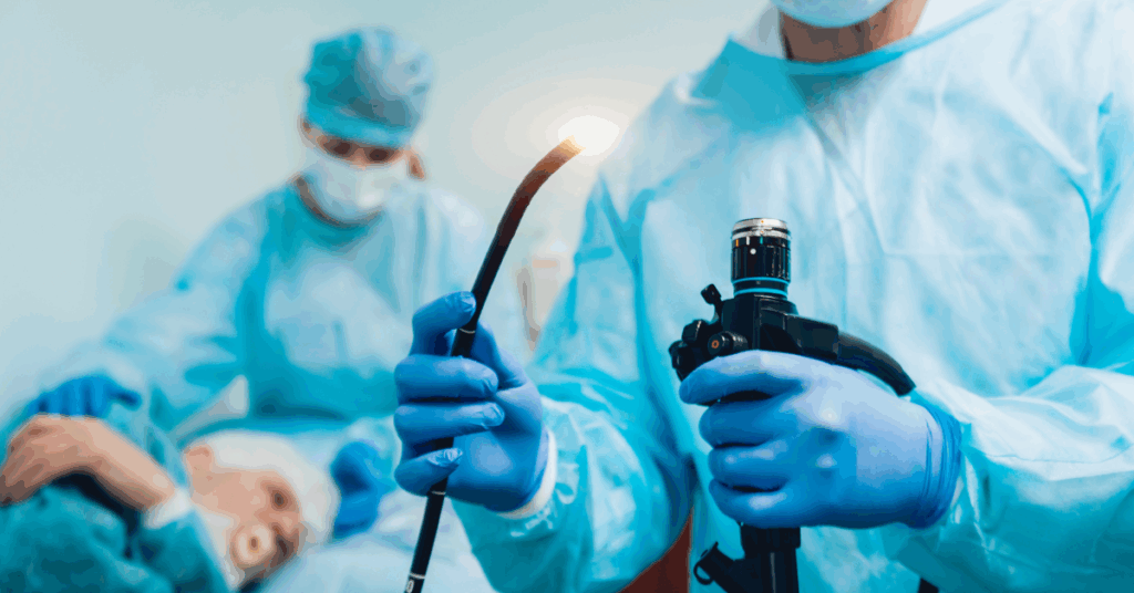 Doctor holding an endoscope before performing an ESG procedure to help achieve weight loss results.