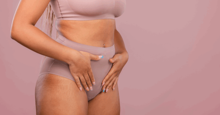 Woman gently holding her stomach, representing the impact of LSG for patients with PCOS on hormonal and metabolic health.